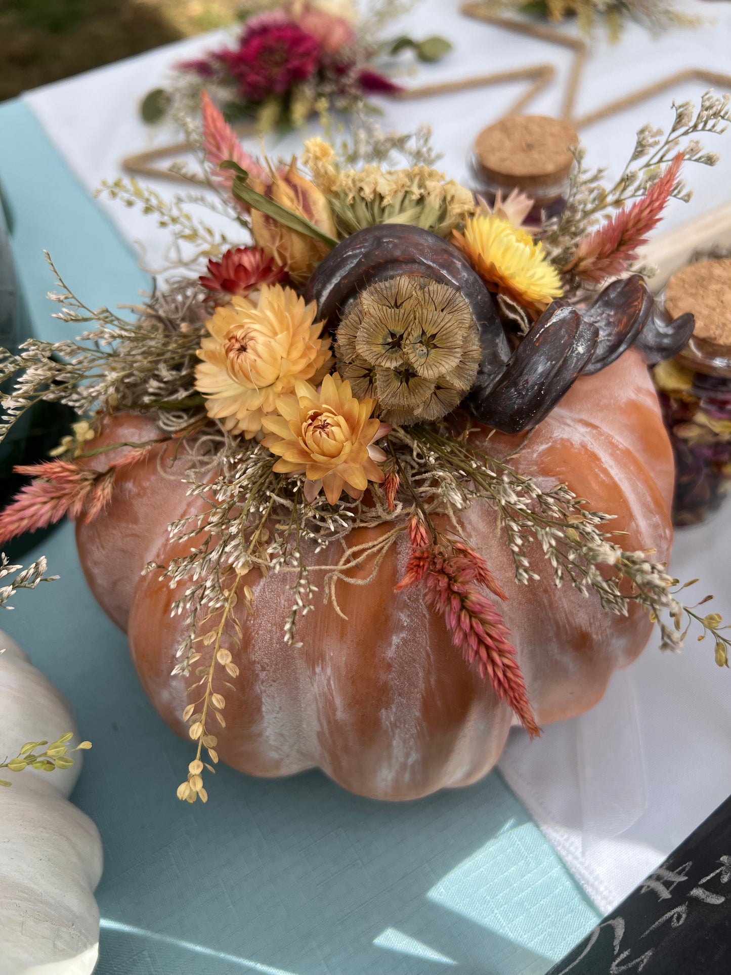 Resin pumpkin with everlasting flowers